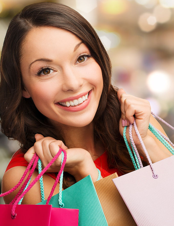 Image of woman holding shopping bags.