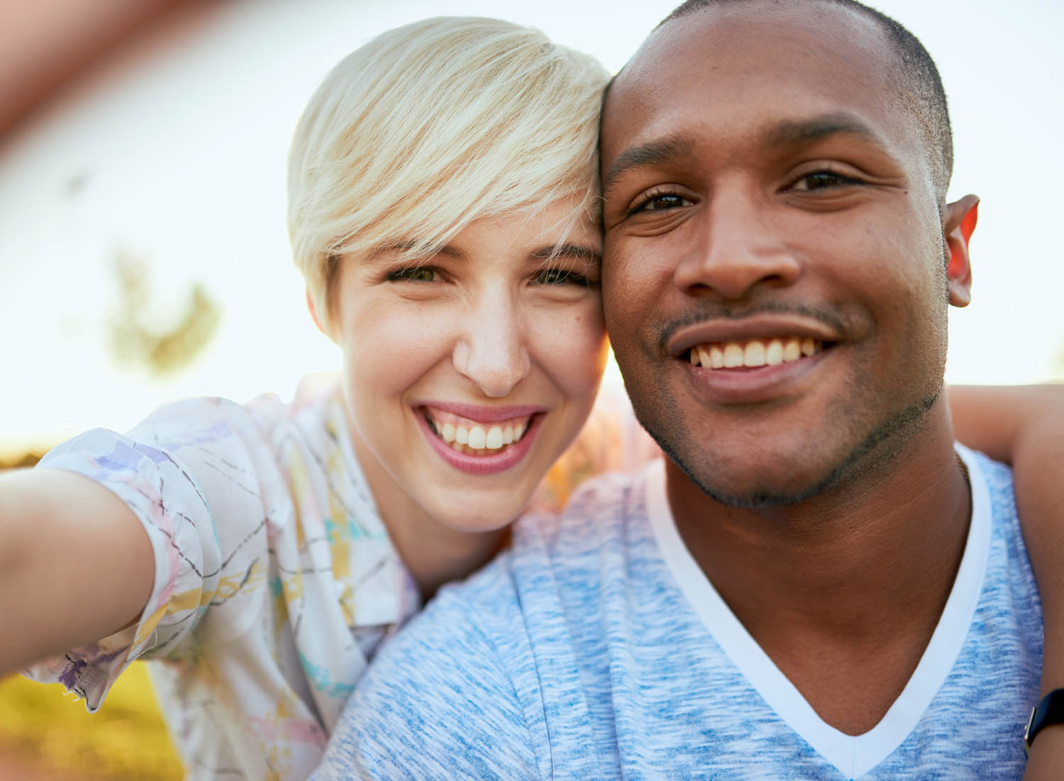 man and woman smiling at the camera