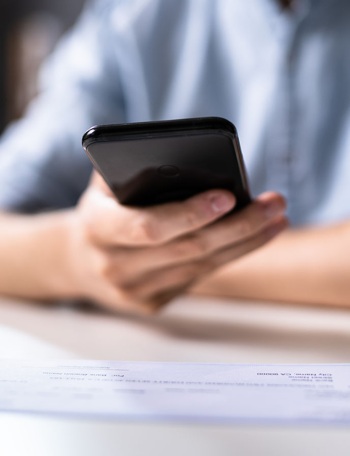 person's hand holding a cell phone