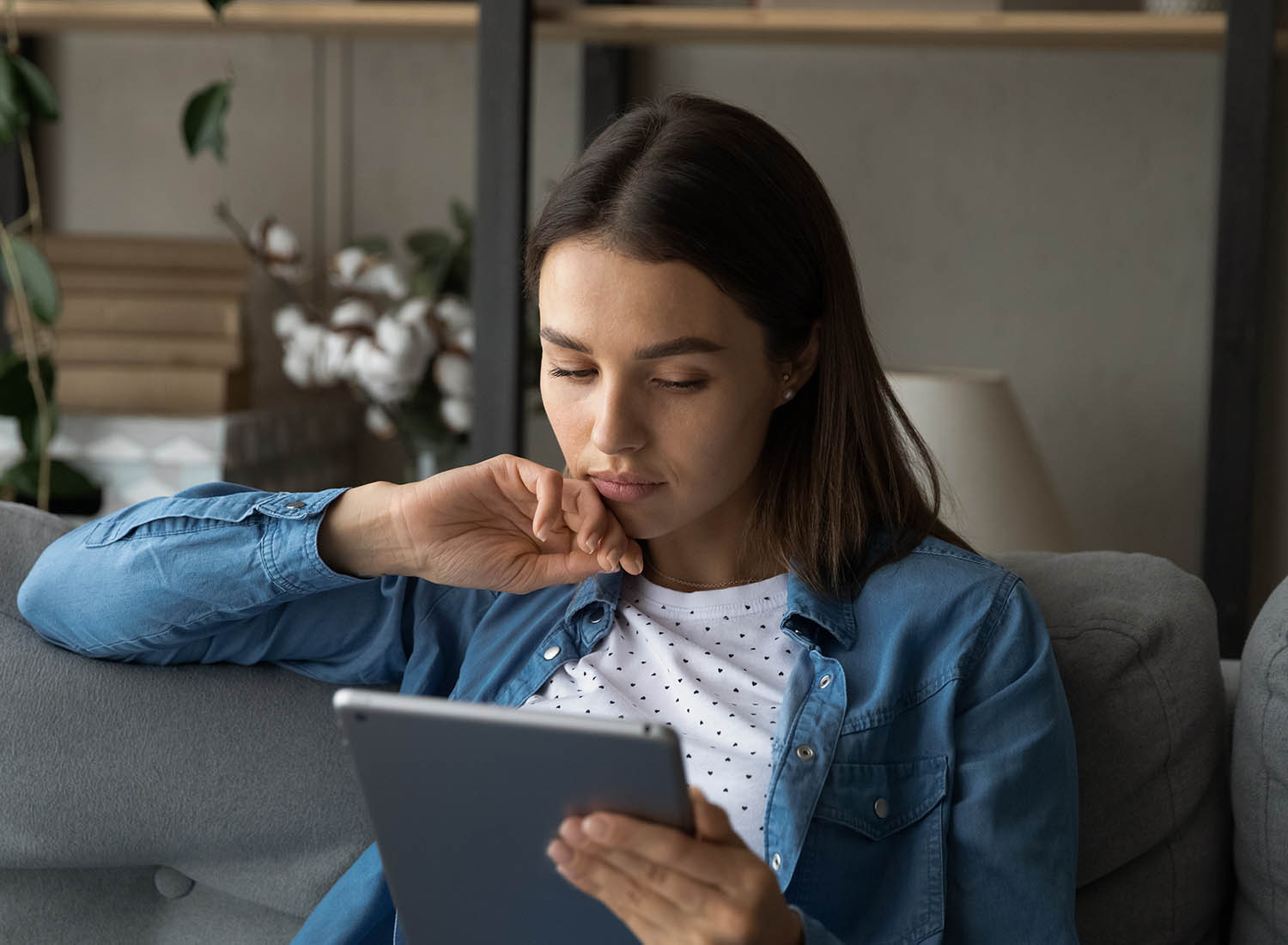 woman looking at ipad